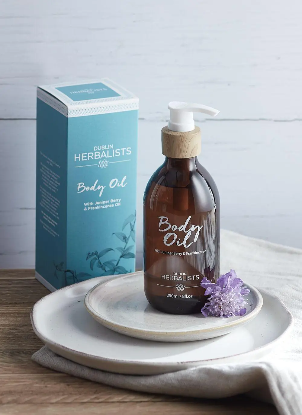 Product and packaging styled shot of Dublin Herbalists body oil.